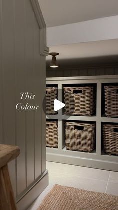 a room with baskets on the wall and a bench in front of it that says, this color