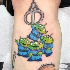 an image of a group of cartoon characters on the side of a woman's leg