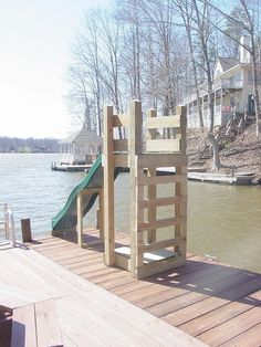 there is a wooden slide on the dock