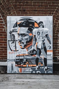 a painting of a football player on the side of a building with an orange and black background