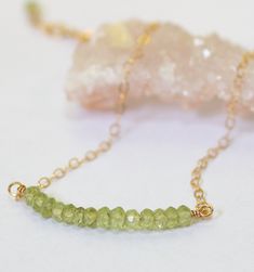 A sparkling peridot gemstone bead bar bracelet. The birthstone for August is this colorful green gemstone, with your choice of sterling silver or gold filled material. A great gift for an August birthday. Wear as a dainty everyday minimal bracelet or paired with other layered bracelets. Peridot Gemstone Beads Jewelry, Peridot Faceted Beads Jewelry Gift, Green Peridot Jewelry With Gemstone Beads, Green Peridot Gemstone Beads Jewelry, Green Birthstone Round Bead Jewelry, Birthday Wear, Minimal Bracelet, Peridot Bracelet, August Birthday