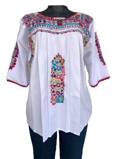 Mexican Embroidered Top.  Beautiful and rich embroideries.   The top would be used as casual or for fiesta cultural event.  Measurement: Medium Neck depth: 5 inches Neck Circumference: 28 inches Under Arm Circumference:  26 Inches Sleeve  Length: 13 inches   Sleeve Width: 12 inches Bust Circumference: 34 inches Waist Circumference: 52 inches Length: 27 Inches Pre washed, will not shrink. Care: Machine Wash/Tumble dry If you have any question, I will be happy to assist you. Shipping Method: My first priority is to provide an excellent service.  During peak shipping season delays are expected, please apologize for any inconvenience shipping service could cause. I will always do my best to ship the item as soon as possible.  Thank you very much for your business. Traditional Peasant Top With Multicolor Embroidery, Traditional Multicolor Embroidered Peasant Top, Folk Peasant Top With Multicolor Embroidered Neckline, Traditional White Peasant Top With Geometric Embroidery, Traditional Multicolor Long Sleeve Peasant Top, Peasant Top With Multicolor Embroidery, Traditional Peasant Top With Embroidered Hem For Festival, Traditional White Peasant Top With Intricate Embroidery, Embroidered Multicolor Peasant Top For Festival