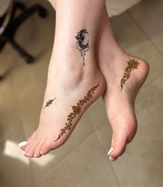 two people with tattoos on their feet