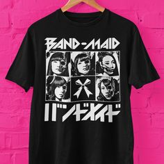 Band-Maid skull faces graphic t shirt. Makes a great gift for J-pop fans, Band-Maid rock fans.  Bella+Canvas 3001 * 100% Air Lume combed and ring spun cotton (fiber content may vary for different colors) * Light fabric (4.2 oz/yd² (142 g/m * Retail fit * Tear away label * Runs true to size With side seams Located along the sides, they help hold the garment's shape longer and give it structural support Shoulder tape Twill tape covers the shoulder seams to stabilize the back of the garment and pre Halloween Concert T-shirt With Screen Print, Pop Culture Graphic Print T-shirt For Concert, Band Merch Tops With Screen Print For Fans, Alternative Band Logo Tops For Music Festivals, Alternative Tops With Band Logo For Music Festivals, Alternative Style Tops With Band Logo For Music Festivals, Alternative Style Graphic Print Tops For Fans, Band Merch T-shirt With Graphic Print For Fans, Black Band Merch T-shirt With Logo