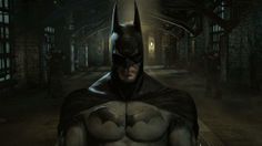 a batman standing in the middle of an alley