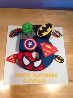 the birthday cake is made to look like a superhero