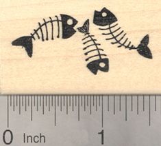 a rubber stamp with fish bones on it