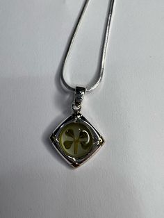 Real four-leaf clover, sterling silver charm. The diameter of the charm is Approximately 1.5cm (about 0.59 in). The necklace is an 18 in sterling silver chain.   This jewelry is perfect for yourself and or as a gift! Whether it's for a birthday, wedding, St. Partrick's day, or just to have; it will always bring you luck. Classic Good Luck Charms Jewelry, Elegant Sterling Silver Good Luck Charm Necklace, Elegant Silver Good Luck Charm Necklace, Silver Necklaces With Flower Charm For Good Luck, Elegant Silver Charm Necklaces For Good Luck, Silver Necklace With Flower Charm For Good Luck, Sterling Silver Green Jewelry For Good Luck, Green Sterling Silver Jewelry For Good Luck, Sterling Silver Round Pendant Charm Necklace For Good Luck