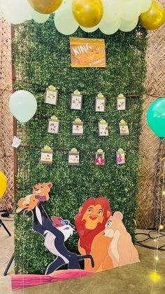 the lion king backdrop with balloons and streamers for a birthday party or baby shower