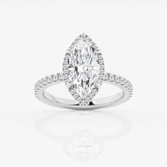 an oval cut diamond ring with pave set shoulders