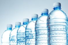 several bottled water bottles lined up in a row