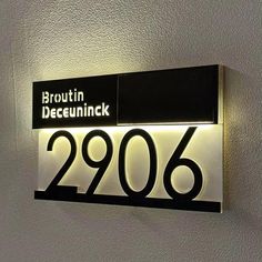 a black and white sign that reads brown deequinck 2096 on it's side