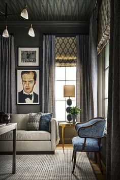 a living room filled with furniture and pictures on the wall above it's windows