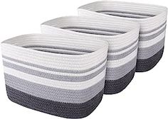 three white and grey baskets sitting next to each other