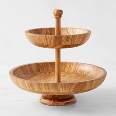 three tiered wooden tray with handles on each side