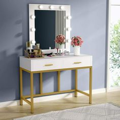 a white vanity with lights on it in a room