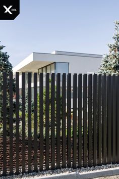 a black metal fence in front of a house