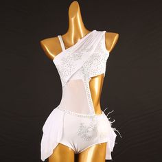 a mannequin wearing a white bodysuit with feathers on it