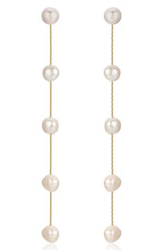 Lustrous freshwater pearls dangle elegantly on long linear drop earrings plated in 18-karat gold. 4 1/8" drop; 3/8" width Pearl size: 8–10mm 18k-gold plate/freshwater pearl Imported Big Bridal Earrings, Hoco Jewelry, Pearl Jewlery, Pearl Drop Earrings Wedding, Formal Earrings, Pear Earrings, Dangle Earrings Wedding, Jewel Wedding, Long Gold Earrings