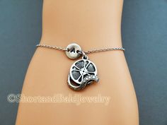 "❖ Film Reel charm: Antique silver pewter. Approx. 6/8\" ❖ Hand Stamped Initial Charm: Antique Silver Pewter. 3/8\" (9mm) Charms are lead free, made in U.S.A. ❖ Bracelet length: 6 & 1/4\" plus 1 & 1/2\" adjustable links = 7 & 3/4\" ❖ No extra charge up to 10\" - Contact me! ❖ Click below for Film Reel charm bracelet in Antique Gold Pewter: https://www.etsy.com/listing/128568080 ❖ Click below for Film Reel charm necklace: https://www.etsy.com/listing/120541105 ❖ Add a birthstone or Fr Adjustable Charm Bracelet Best Friend Gift, Adjustable Silver Novelty Jewelry, Adjustable Charm Bracelet For Best Friend Gift, Adjustable Charm Bracelet Gift For Best Friend, Adjustable Themed Charms Jewelry, Silver Vintage Jewelry For Friendship, Adjustable Sterling Silver Charm Bracelet With Initials, Vintage Adjustable Jewelry For Mother's Day, Personalized Adjustable Metal Charm Bracelet