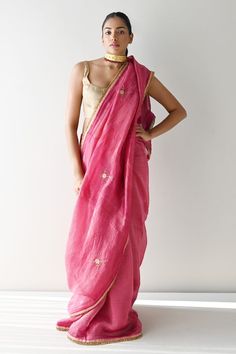 Hot pink chanderi silk and tissue pin stripe saree with scattered floral butti embroidery using cutdana, sequins and elevated by golden lace trims. - Aza Fashions Pink Slub Silk Traditional Wear For Puja, Pink Raw Silk Pre-draped Saree With Dupatta, Pink Tussar Silk Traditional Wear With Gota Work, Pink Slub Silk Saree For Festive Occasions, Pink Slub Silk Saree For Navratri, Tussar Silk Traditional Wear With Gota Work For Puja, Pink Tissue Silk Pre-draped Saree With Gota Work, Pink Slub Silk Saree For Diwali, Pink Pre-draped Saree With Dupatta In Tissue Silk