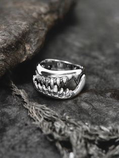 Dive into the depths of dark elegance with our Jaws Horror Goth Ring, meticulously handcrafted from high-quality 925 sterling silver. This striking ring features a menacing shark tooth design, perfect for fans of horror, gothic style, and Halloween enthusiasts. Inspired by the classic terror of "Jaws," this ring captures the essence of primal fear and power. The detailed shark tooth is designed to stand out, making a bold statement with its sharp, polished edges and dark, mysterious aura. Ideal Halloween Silver Claw Jewelry, Halloween Silver Open Ring, Primal Fear, Goth Ring, Silver Shark, Dark Mysterious, Tooth Design, Dark Elegance, Edgy Jewelry