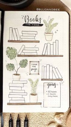 a notebook with books and plants on it