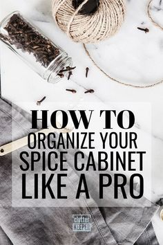 the words how to organize your spice cabinet like a pro on top of a marble counter