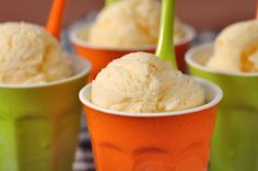 three cups filled with ice cream on top of a table