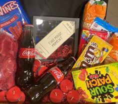 an assortment of snacks and candy in a box