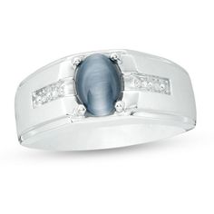 He’ll proudly show his clever side with this mesmerizing ring. Fashioned in cool 10K white gold, this mystifying look showcases an 8.0 x 6.0mm oval-shaped simulated soft Grey cat’s eye. Rows of diamond accents shimmer along the satin-finished center row of the shank while stepped polished borders lend dimension and depth to the design. Buffed to a brilliant luster, this ring brings dramatic flair to any attire. Modern White Gold Oval Cabochon Rings, Oval Diamond Moonstone Ring In White Gold, Oval Moonstone Diamond Ring In White Gold, Platinum Oval Cabochon Ring With Center Stone, Modern 14k White Gold Jewelry With Accent Stones, White Gold Oval Cabochon Ring With Polished Finish, Oval Moonstone Ring With Diamond Accents For Anniversary, Modern Silver Sapphire Ring With Diamond Accents, Modern White Gold Jewelry With Oval Cabochon