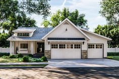 a white house with two car garages on the front