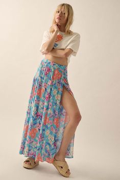 Floral-print crepe maxi skirt. Wrap design with interior tie closure. Elastic waistband with button loop closure. Tiered silhouette. Ankle length. Loose fit. Imported. Designed in LA. Model wears size S. Grow With The Flow, Skirt Wrap, Wrap Maxi Skirt, French Blue, Ankle Length, Maxi Skirt, Floral Print, Loose Fitting, Floral Prints