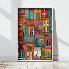 an art print on the wall of a room with wooden floors and white walls, featuring colorful