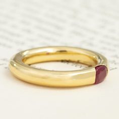 We recently acquired a stack of hefty, gold tubular bands with flush-set gemstones that we’re totally obsessed with! This one centers on a bright raspberry-red ruby, which looks like perfection in yellow gold. Each of these bands feels buttery on the hands, with a delicious weight to boot. A beautiful stacker, but just as gorgeous when worn solo. 18kt yellow gold Size 6.25 and slightly resizable with limitations. Ruby measures 5.4 x 3.84 x 2.83mm, VS2/SI1 type II clarity. GIA standards. Please s Classic Gold Stackable Ruby Ring, Gold Stackable Rings With Ruby Bezel Setting, Yellow Gold Stackable Ruby Ring, Modern Gold Ruby Ring With Polished Finish, Handmade Yellow Gold Ruby Ring, Fine Jewelry, Stack Overflow, Modern Mens Rings, Art Jewelry Earrings, Raspberry Red