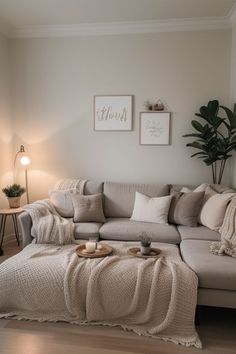 a living room filled with furniture and a large white blanket on top of the couch