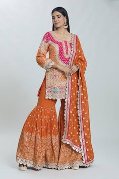 Orange padded kurta with sequin pearl embellished, floral zardozi embroidered patterns . Comes with can can attached sharara and dupatta. - Aza Fashions Fitted Sharara With Dabka Work For Navratri, Orange Georgette Sharara With Zari Work, Semi-stitched Chinon Sharara For Navratri, Fitted Sharara With Dabka Work For Transitional Season, Transitional Fitted Sharara With Dabka Work, Semi-stitched Chinon Sharara With Gota Work, Chinon Sharara With Dabka Work For Navratri, Orange Georgette Sharara With Dabka Work, Diwali Chinon Sharara With Dabka Work