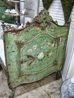 an old green bed with moss growing on it's headboard and foot board