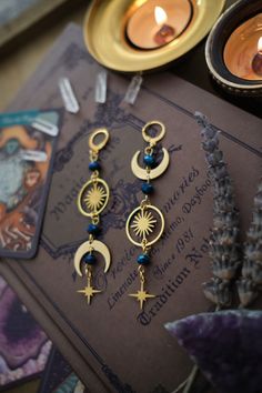 * Stunning mismatched statement earrings 🖤 These stainless steel Moon and Stars earrings will give your outfit an instant witchy, mystical touch. * Stainless steel! * The total length of the earrings is approximately 9 cm (aprox 3.5 inches), hook included.  * They come in a pretty little burlap pouch 🖤 *Matching necklace available here: https://www.etsy.com/listing/1447894232/witchy-choker-necklace-witchy-silver Fun Earrings Aesthetic, Witchy Products, Mystical Internally Threaded Jewelry For Gifts, Mystical Internally Threaded Jewelry As Gift, Mystical Internally Threaded Jewelry For Gift, Mystic Jewelry, Celestial Style Earrings As Gift, Celestial Style Festival Earrings, Celestial Cartilage Earrings With Moon Charm As Gift