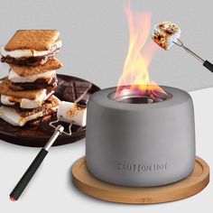 a toaster with marshmallows on it is being used as a fire pit