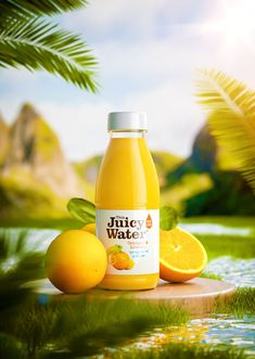 a bottle of juice sitting on top of a wooden table next to some oranges