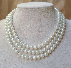 Three layer shell pearl necklace,  bridal ivory white pearl necklace,romantic wedding, mother of bride jewelry, 8mm round pearl, The crown Beautiful 3 strand shell pearls, meticulously knotted and finished with a box clasp with three brilliant cut crystals.  The pearls are 8mm and a natural white color. Shell pearls are made with the shells of oysters the pearls come from, therefore they have the same kind of weight and beauty. The shells are ground and the material is compacted to form the roun Three Layer Pearl Necklace, Wedding Mother Of Bride, Pearl Necklace Bridal, Layered Pearl Necklace, Bride Necklace, Bride Jewelry, Necklace Bridal, White Pearl Necklace, Beaded Jewelry Designs