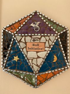 a mosaic piece with words on it that says roll inititiative and an image of a dragon