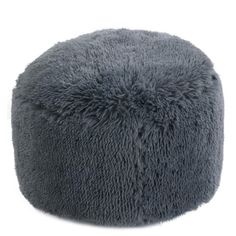 a large gray poufce sitting on top of a white floor