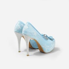 Lady Bella is a pair of custom made shoes in sweet baby blue satin. This pair of wedding heels features silky satin fabric with ivory white lace overlay. The front of this bridal heel features a dainty bow and the 4.5 inch heel of this bridal shoe is finished in silver glitter fabric. This pair of shoes is made using satin, glitter, lace, PU and other synthetic materials. They can be customized in different heel heights, colors and styles. They come with 0.5 inch elevated platform front. CUSTOMI Satin Closed-toe Wedding Shoes, High Heel Satin Wedding Shoes, Satin High Heel Wedding Shoes, Satin Closed Toe Wedding Shoes, Closed Toe Satin Heels For Wedding, Satin Closed Toe Heels For Wedding, Light Blue Round Toe Evening Wedding Shoes, Elegant Light Blue Wedding Shoes For Formal Occasion, Light Blue High Heel Wedding Heels