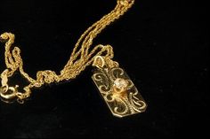 "This is a very beautiful, vintage and unique DIAMOND 14K GOLD pendant necklace (weight 3.2). The necklace has a marvelous engraved decoration, brilliant cut diamond (3.5 mm) and 14K gold (bottom has S-I 14KT) and chain (bottom has 14K). The necklace has a very extravagant and elegant feel to it. It measures 1\" x 7/16\" pendant and 21 1/2 long chain. The necklace is in very good condition. 0.7 MR" Vintage Pendant Diamond Necklace With Single Cut Diamonds, Heirloom Diamond Necklace With Intricate Design, Elegant Engraved Diamond Necklace, Antique Diamond Cut Pendant Necklace, Vintage Diamond Necklace In Yellow Gold, Heirloom Diamond Pendant Necklace, Ornate Yellow Gold Diamond Necklace, Anniversary Diamond Pendant Necklace With Filigree, Victorian Diamond Necklace With Single Cut Diamonds As Gift