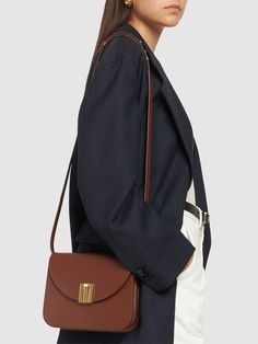 Height: 17cm Width: 22cm Depth: 7cm. Strap drop: 50cm. Fixed strap. Front flap with clasp closure. Two internal compartments. One internal zip pocket Modern Evening Saddle Bag With Turn-lock Closure, Elegant Leather Flap Bag With Turn-lock Closure, Luxury Shoulder Bag With Fold Over Clasp For Work, Timeless Saddle Shoulder Bag With Turn-lock Closure, Timeless Shoulder Saddle Bag With Turn-lock, Timeless Shoulder Saddle Bag With Turn-lock Closure, Modern Formal Satchel With Magnetic Closure, Elegant Formal Satchel With Fold Over Clasp, Luxury Brown Shoulder Bag With Fold Over Clasp