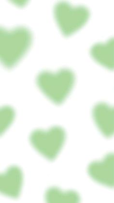 a white and green spotted background with hearts