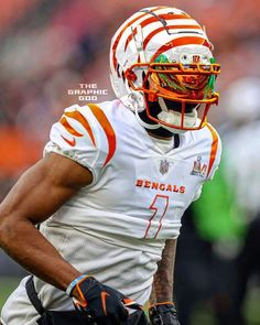 a football player wearing an orange and white uniform