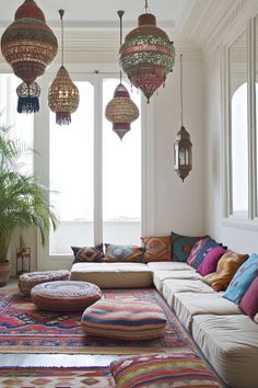 a living room filled with lots of colorful pillows